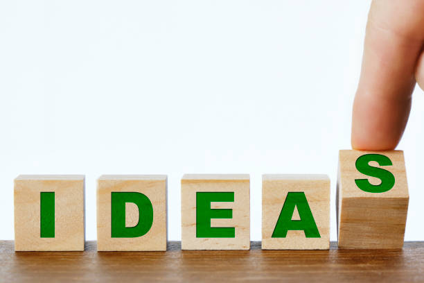 istock Ideas written on wooden blocks, making ideas from an idea 1311043500