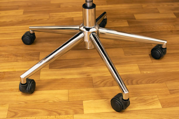istock Office chair wheels on a wood floor 1311044952
