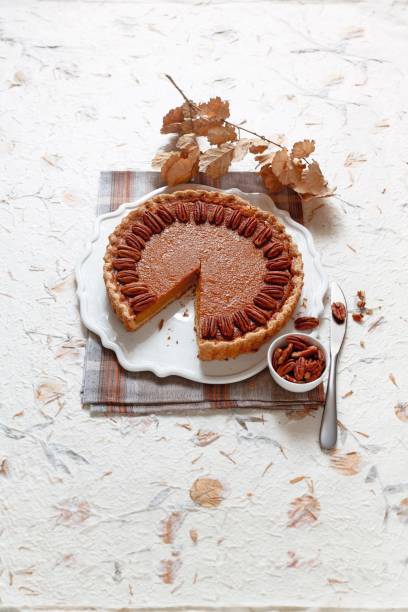 istock Pumpkin pie with chocolate and pecan nuts 1311047758
