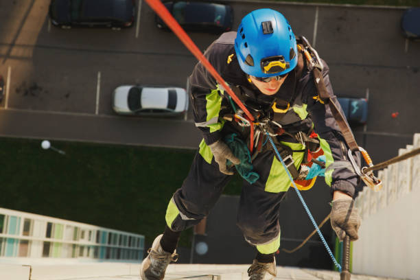 istock Industrial mountaineering worker hangs over residential facade building while washing exterior facade glazing 1311047927