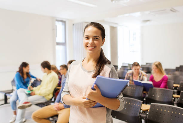istock group of smiling students in lecture hall 1311051482