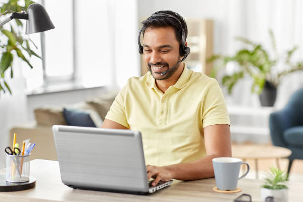 istock indian man with headset and laptop working at home 1311054693