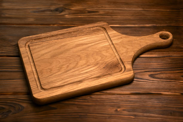 istock vintage cutting board with space for text on old wooden background, close-up 1311054800