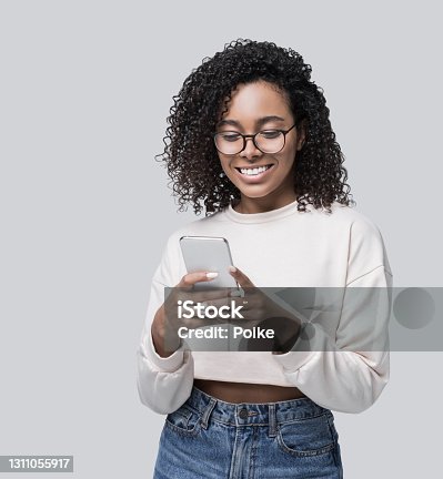 istock Happy laughing woman student using smart phone 1311055917