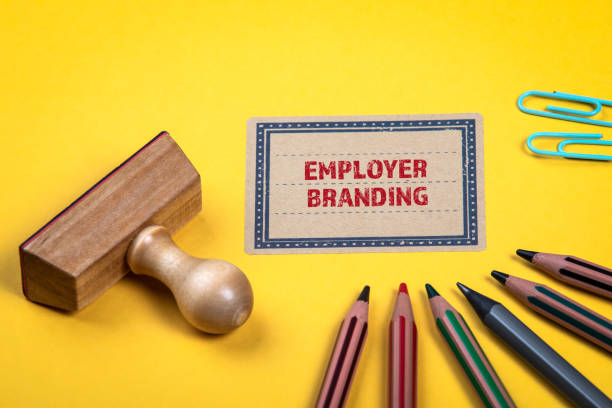 istock Employer Branding concept. Yellow notes and documents folder. Office supplies 1311057389