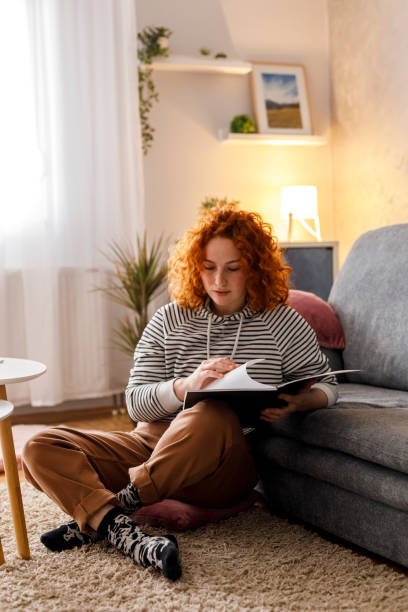istock Female university student studying at home 1311057578