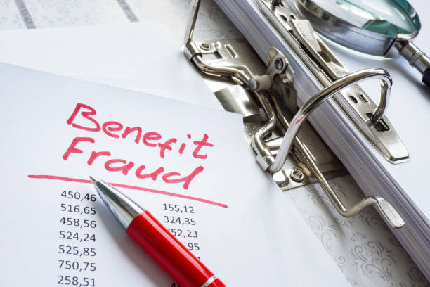 istock Benefit fraud words in the folder with audit results. 1311057678