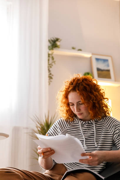 istock Female university student reading the papers and studying 1311057735
