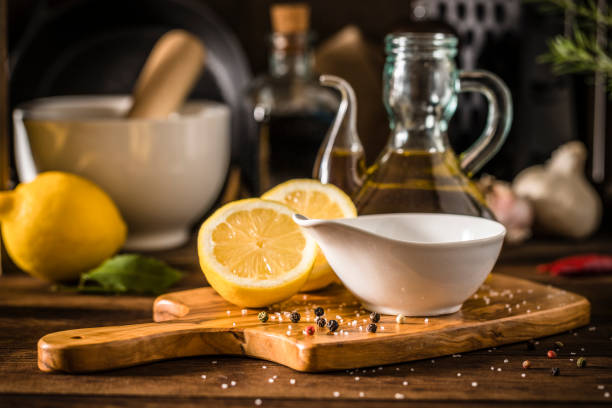 Lemon vinaigrette dressing on a rustic wooden table