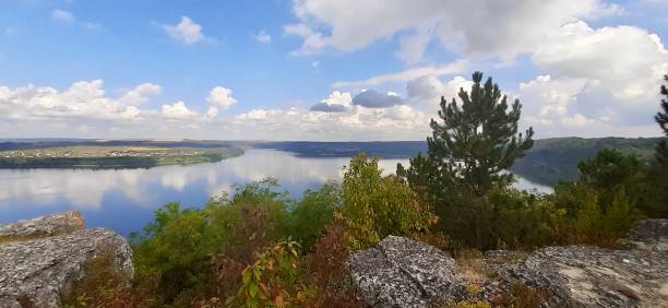 Summer Landscape With River or lake Reflecting Clouds On The Blue Sky stock photo