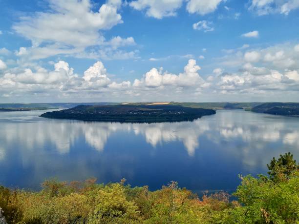 Summer Landscape With River or lake Reflecting Clouds On The Blue Sky stock photo