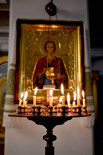 istock burning candles in church 1311061159