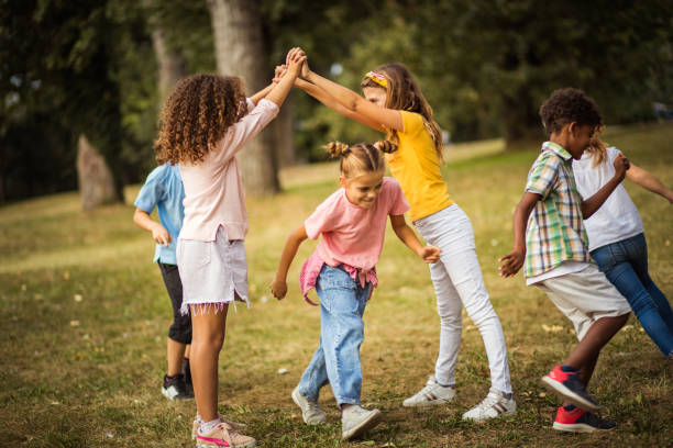 istock Kids playing in schoolyard. 1311061284