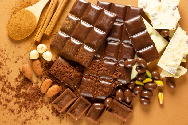 istock White and milk chocolates. Almond, pistachio, hazelnut.. background, texture.. 1311061378