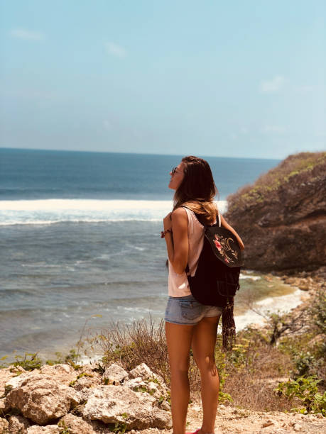 istock Woman enjoying tropical beach view. 1311062321