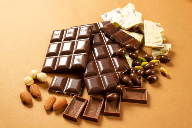 istock White and milk chocolates. Almond, pistachio, hazelnut.. background, texture.. 1311062601