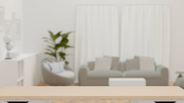 istock 3D rendering, Empty wooden table in blurred cozy living room background, copy space 1311065918
