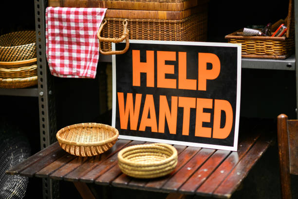 istock Help Wanted sign displayed in a shop in a job vacancy concept 1311067392