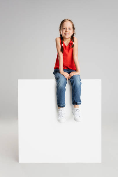 istock Happy kid, girl isolated on white studio background. Looks happy, cheerful, sincere. Copyspace. Childhood, education, emotions concept 1311068356