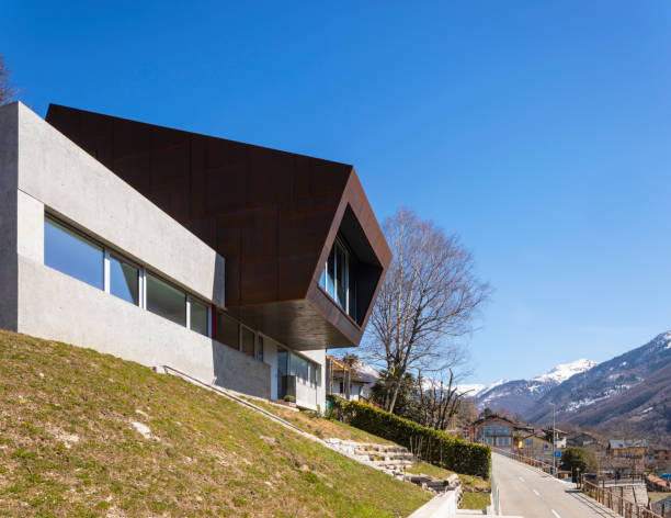 istock Exterior modern isolated villa, surrounded by nature. Iron and concrete cladding 1311069812