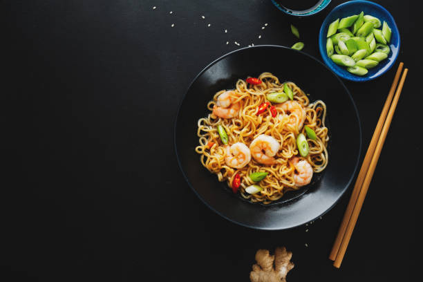 istock Asian noodles on plate on dark background 1311070110