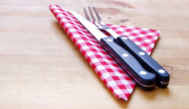 istock Steak knife and fork with red carded napkin 1311071288