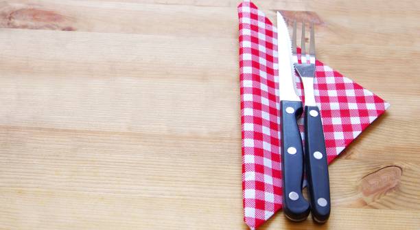 istock Steak knife and fork with red carded napkin 1311071311