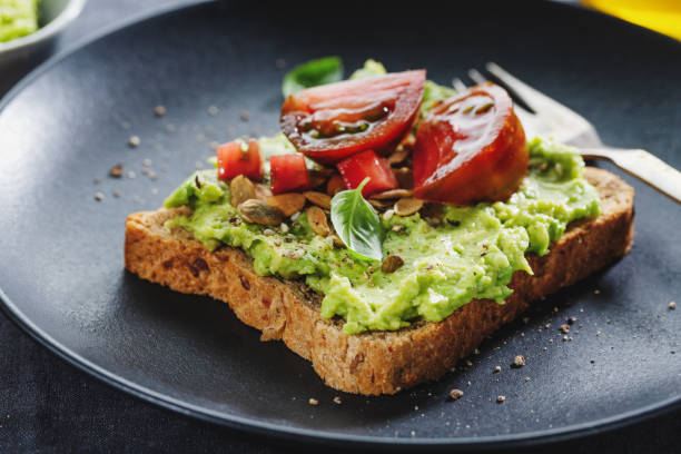 istock Tasty sandwich on wholegrain bread with mashed avocado 1311071437
