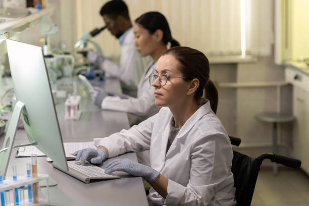 istock Woman working on computer in the lab 1311071515