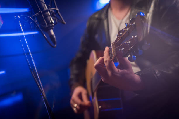 istock Male singer singing song in studio 1311071534