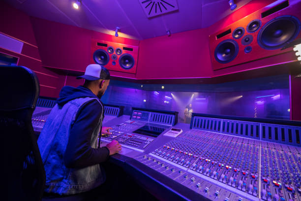 istock Musician operating audio mixer in recording studio 1311071724