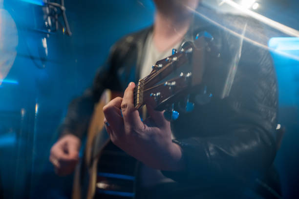 istock Male singer singing song in studio 1311072526