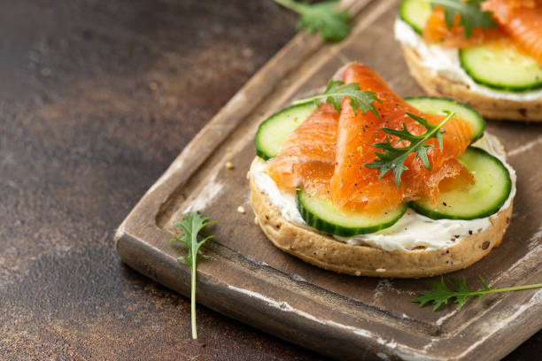 istock Fresh bagel with Salmon, cream cheese and cucumber 1311074712