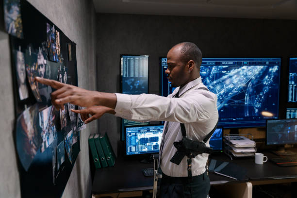 istock A private investigator is working on a case late at night 1311075409