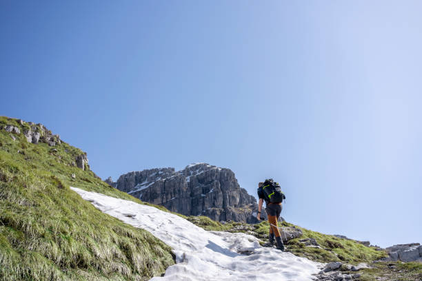 istock Solo Hiker walking on the trail on the mountain crest 1311076508