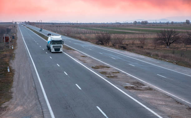 istock cement truck on road 1311078336