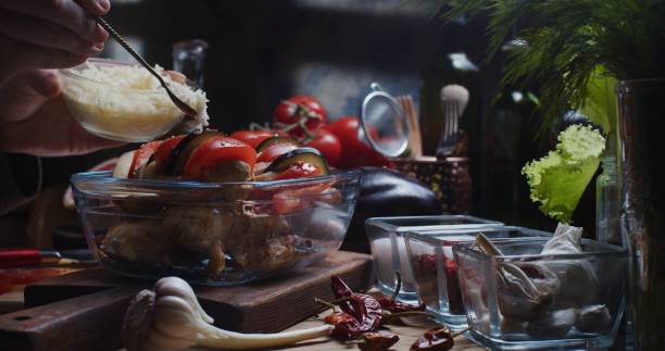 istock Preparing chicken fillet with tomatoes and eggplants 1311080855