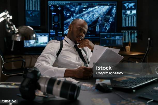 Investigator At His Workplace Stock Photo Stock Photo - Download Image Now - Criminal Justice, Spy, Police Force