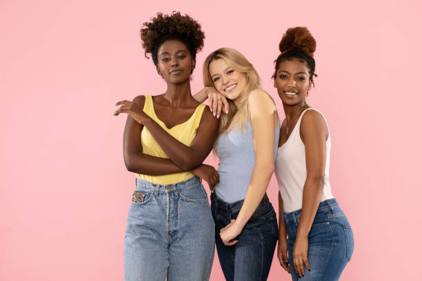 Three multi ethnic female friends having fun together.