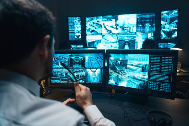 istock Police officers at surveillance control center wide 1311084124