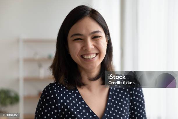 Overjoyed Pretty Asian Woman Look At Camera With Sincere Laughter Stock Photo - Download Image Now