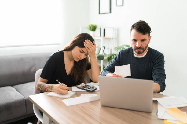 istock Worried married couple looking at their financial problems 1311084945