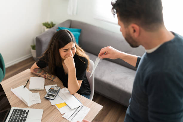istock Husband complaining to his wife about her debt 1311084978