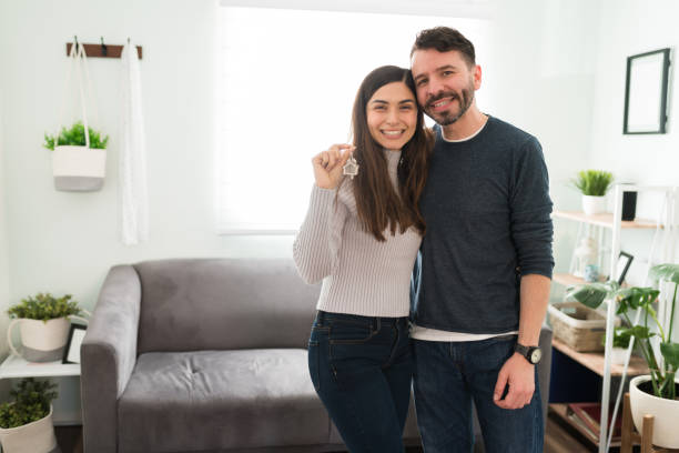 istock Attractive couple feeling happy after getting their new house 1311085485