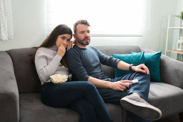 istock Husband and wife watching a romantic movie 1311085563