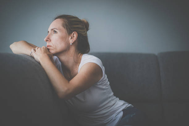 istock Depressed mid-aged woman at home feeling sad, lonely, anxious 1311086920