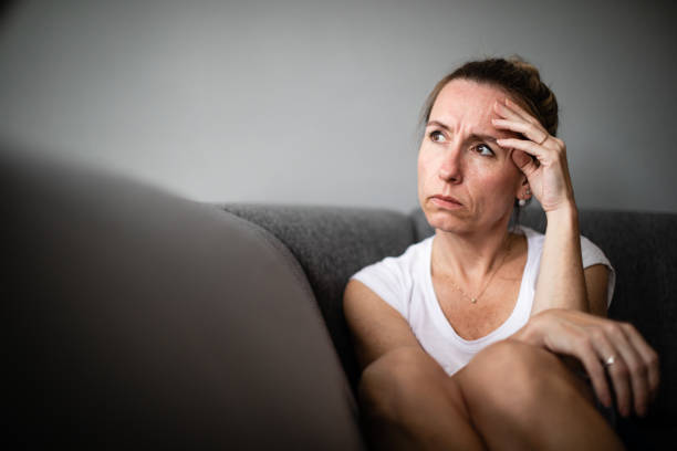 istock Depressed mid-aged woman at home feeling sad, lonely, anxious 1311086922