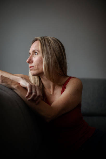 istock Depressed mid-aged woman at home feeling sad, lonely, anxious 1311087003