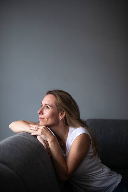 istock Depressed mid-aged woman at home feeling sad, lonely, anxious 1311087059