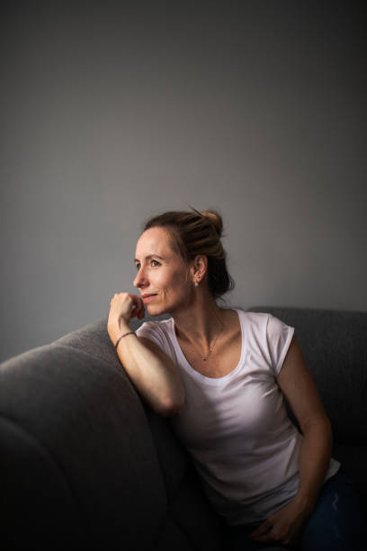 istock Depressed mid-aged woman at home feeling sad, lonely, anxious 1311087243